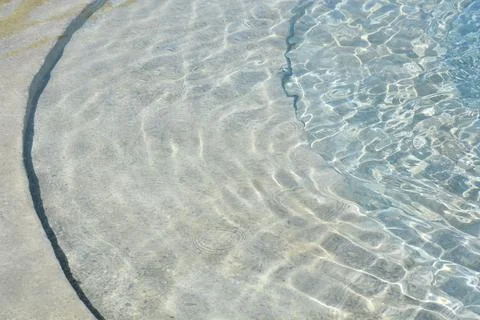 Curved concrete pool steps under water Stock Photos