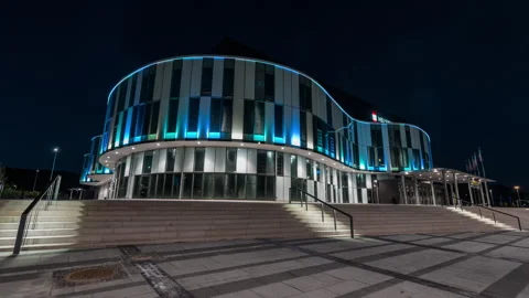 Curved Helsingborg Arena Facade Illuminated Blue at Night Stock Footage 341880438