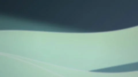 Curved layers of white paper glide in a seamless loop Stock Footage 342519122