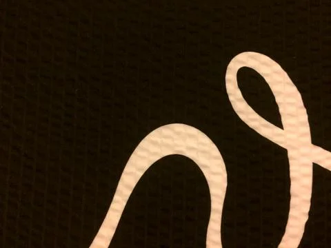Curved line on black background Stock Photos