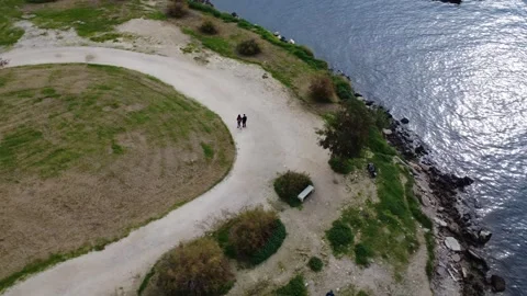 Curved Park Path Along Rocky Coast At Sunset By The Sea Stock Footage 343995226