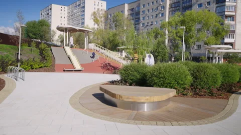 Curved path and round bench shape landscaped park zone Vídeo Stock 332116468