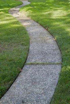 Curved path grass lawn Stock Photos