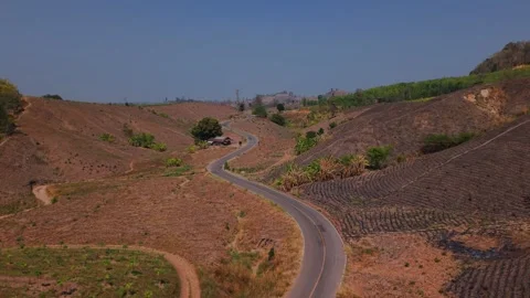 Curved Paths of the Desert: Journey Through Barren Mountains Stock Footage 301700403