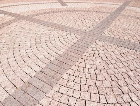 Curved patterned stone pavement with cross lines Stock Photos