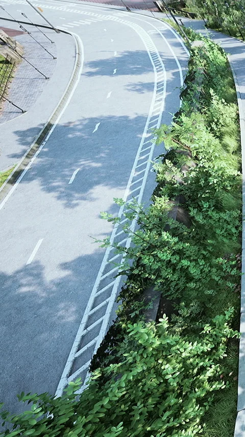Curved road with greenery along a pathway in a city park setting Vidéo 337941089