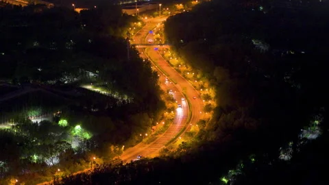 Curved road light and shadow night lights traffic flow Stock Footage 245014989