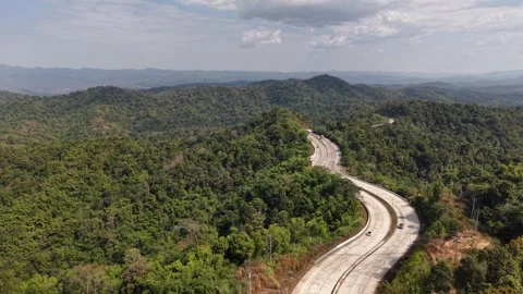 Curved Road in Mountains Under Soft Daylight Stock Footage 327509210