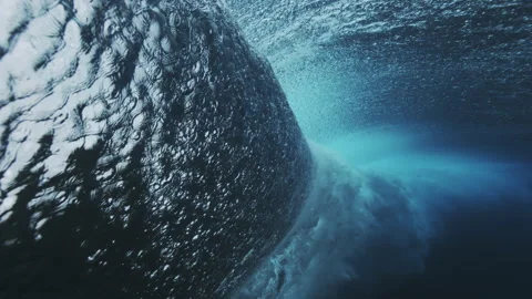 Curved Underwater Wave Face with Dramatic Shadow Stock Footage 329090410