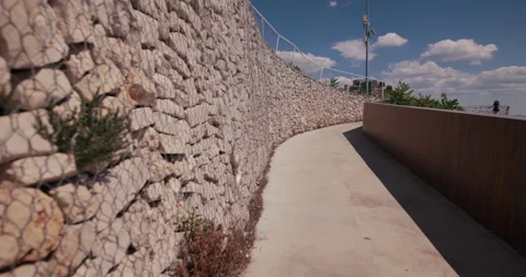 Curved Waterfront Walkway Between Stone Walls Stock Footage 336605147