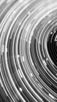 Curved white light trails sweep across a black background, forming a monoch.. Stock Illustration