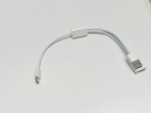 Curved white USB type C adapter cable on white background Stock Photos