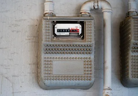 Curves of the gas pipe on the background wall. Multiple city gas meters. Korea Stock Photos