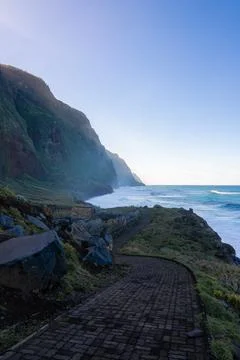 Curving cobblestone path along cliffs on Madeira Island, Portugal Stock Photos