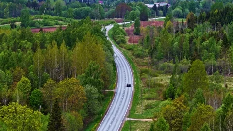 Curving Countryside Road Through Lush Spring Forest, Aerial View Видео 336660448