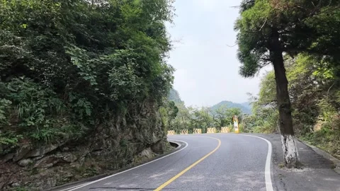 Curving Mountain Road with Warning Bollards, Lushan Slow Motion Stock Footage 346700944