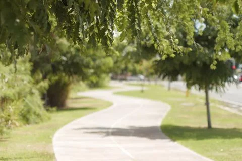 Curving path with grass into the distance Stock Photos