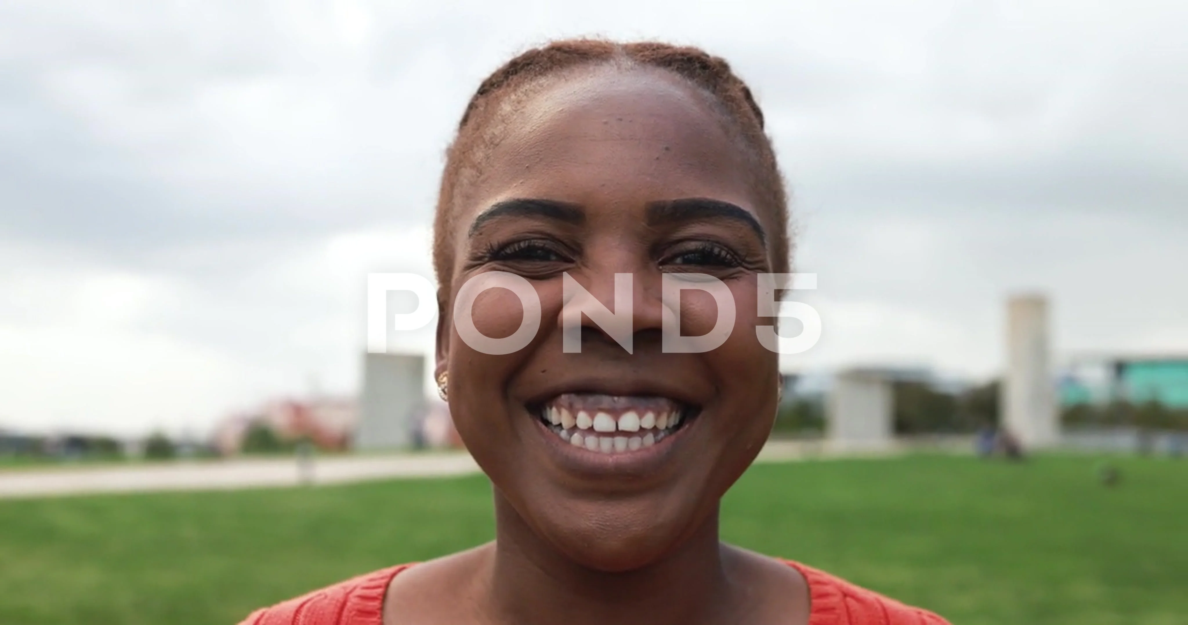 Curvy african woman smiling on camera outdoor