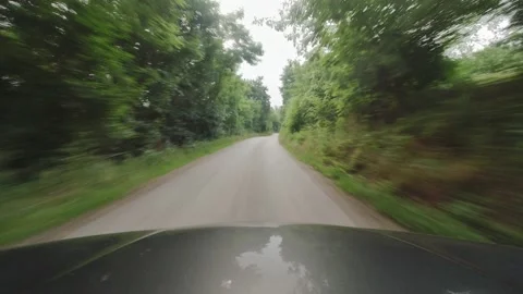 Curvy and bumpy road through the woods 4K video Video stock 158514901