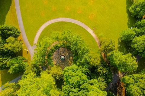 A curvy path through the green meadow Stock-Fotos