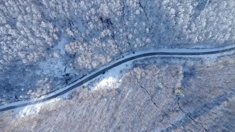 Curvy road on a mountain in winter 스톡 동영상 267082418