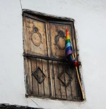Cusco flag in closed window Stock Photos
