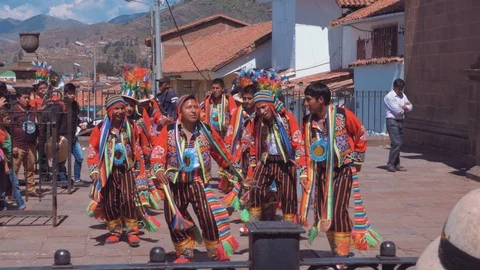 CUSCO, PERU - APRIL, 2018: Folkloric men dancing outside a Church on Festival Stock Footage 91405415