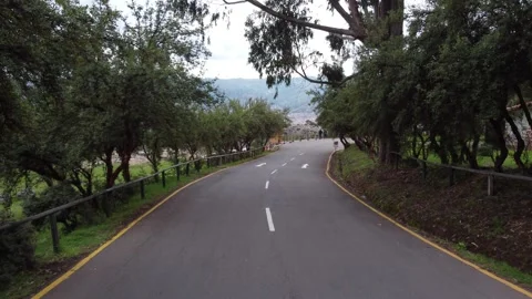 Cusco winding road through green trees Stock Footage 337807535