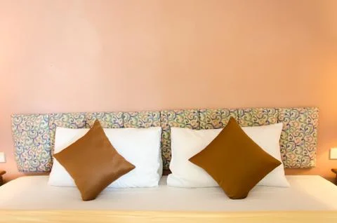 Cushions on bed Foto stock