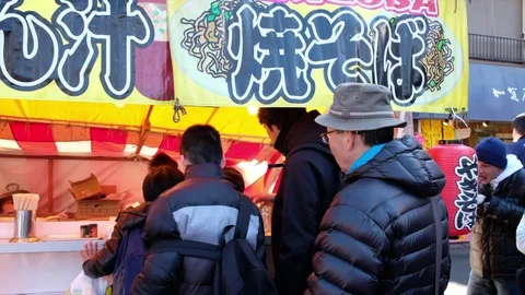 CUSOTMERS AT FOOD STALL Stock Footage 84292766