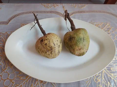 Custard apple in a plate at table Stock Photos