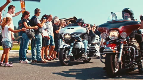 Custom bikes with LED lights and various flags at the motorcycle parade Stock Footage 68659274
