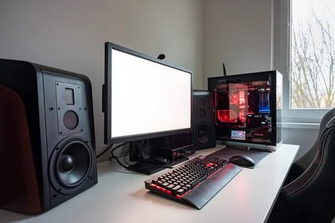 Custom built gaming computer with white screen, keyboard, mouse, desktop, c.. Stock Photos