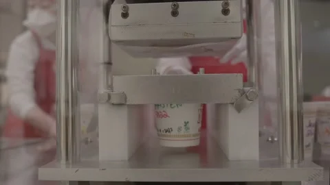 Custom cup noodle being sealed Video stock 228756187