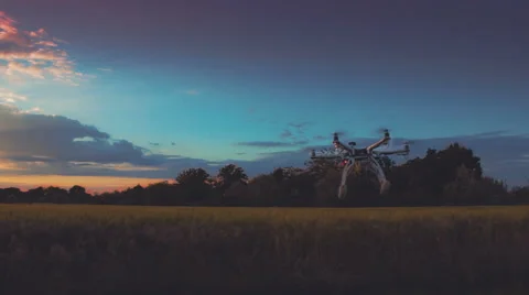 Custom drone hexacopter takes off at sunset (slow motion) Video stock 64104214