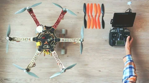 Custom drone (hexacopter) testing and run on the wooden floor Vídeo Stock 64734834