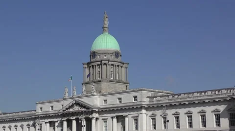 Custom House Dublin deep blue sky flags flying green dome Stock Footage 64857991