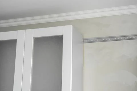 Custom kitchen cabinets installation with a white furniture facades mdf. Gray Stock Photos