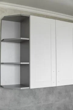 Custom kitchen cabinets installation with a white furniture facades mdf. Gray Stock Photos