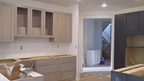 Custom kitchen cabinets in various stages of installation base for of kitchen Vidéo 98763470