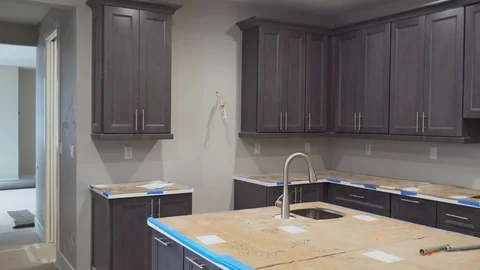 Custom kitchen cabinets in various stages of installation base for of kitchen Vidéo 99811014