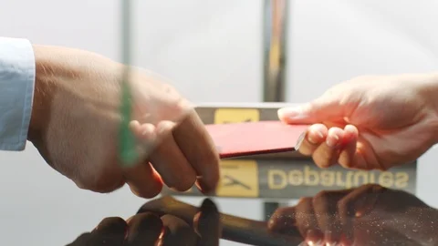 Custom officer checking and stamping a travelling passport with boarding card Stock-Footage 94083176