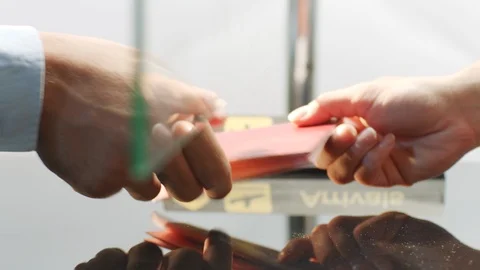 Custom officer checking passport at arrivals in the airport Stock Footage 94084990