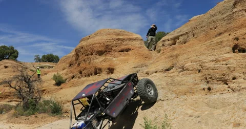 Custom powerful 4x4 offroad Jeep climbs rocky mountain DCI 4K Stock Footage 63370451