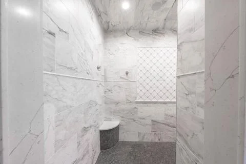 Custom shower project has been completed with new fixtures and ceramic tile Stock Photos