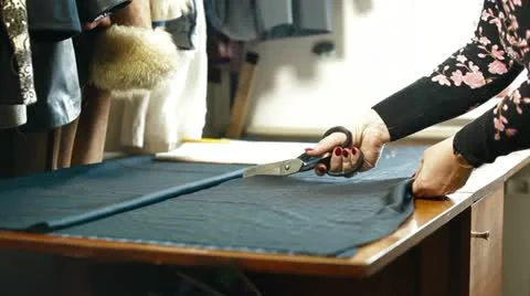 Custom Tailor Cutting a Sewing Pattern Stock Footage 22086705