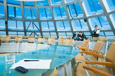 Customary conference room: glassy table, chair, large window Stock Photos