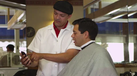 Customer and barber talking about hairstyles 스톡 동영상 67348360