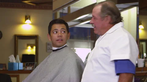 Customer and barber talking about hairstyles Stock Footage 67348399