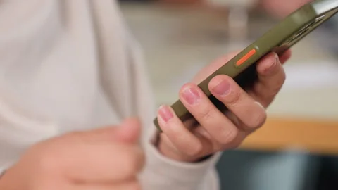 Customer Browsing Smartphone Screen Indoors Stock Footage 307136889